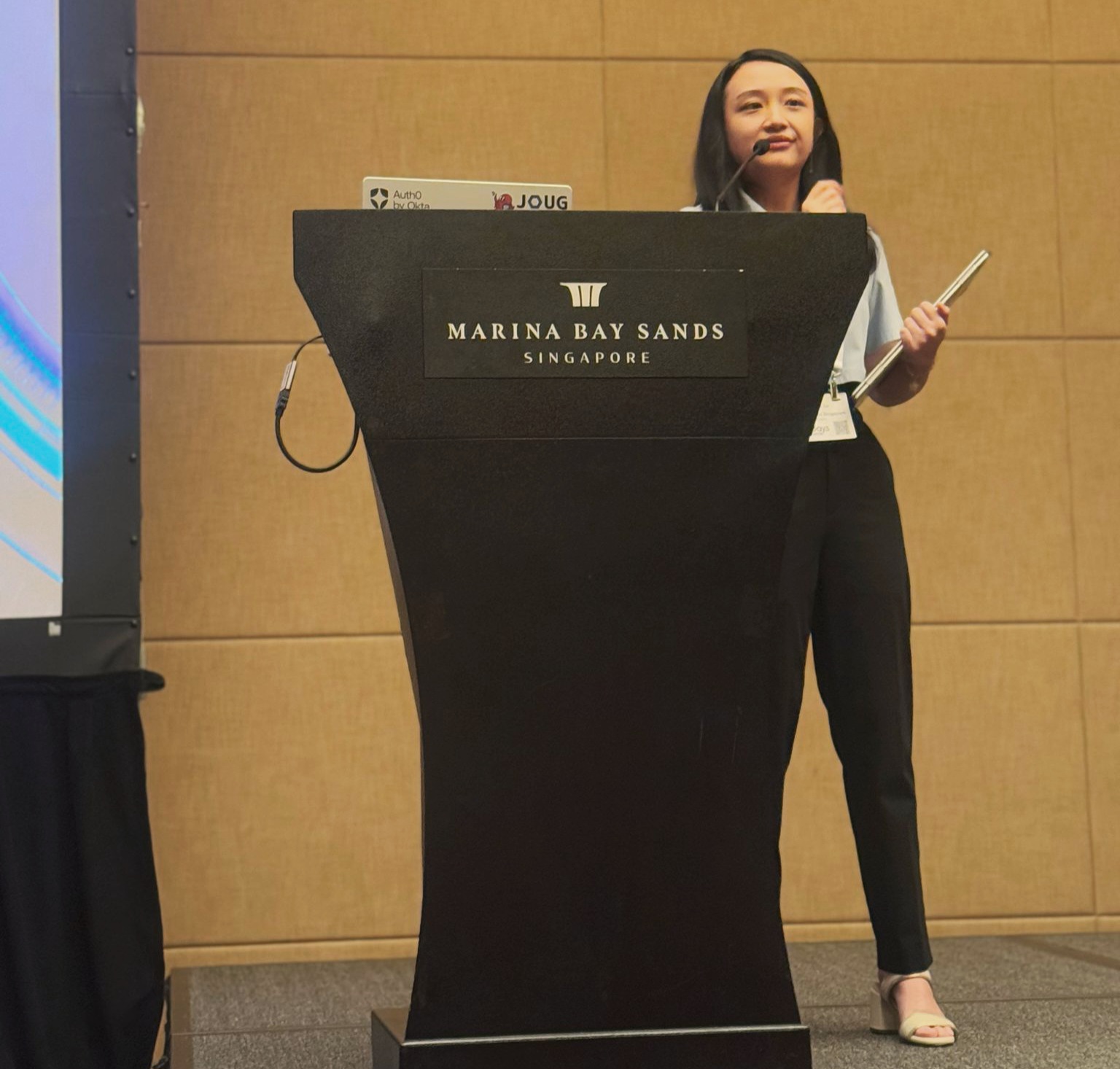 Victoria presenting on stage at APIdays Singapore